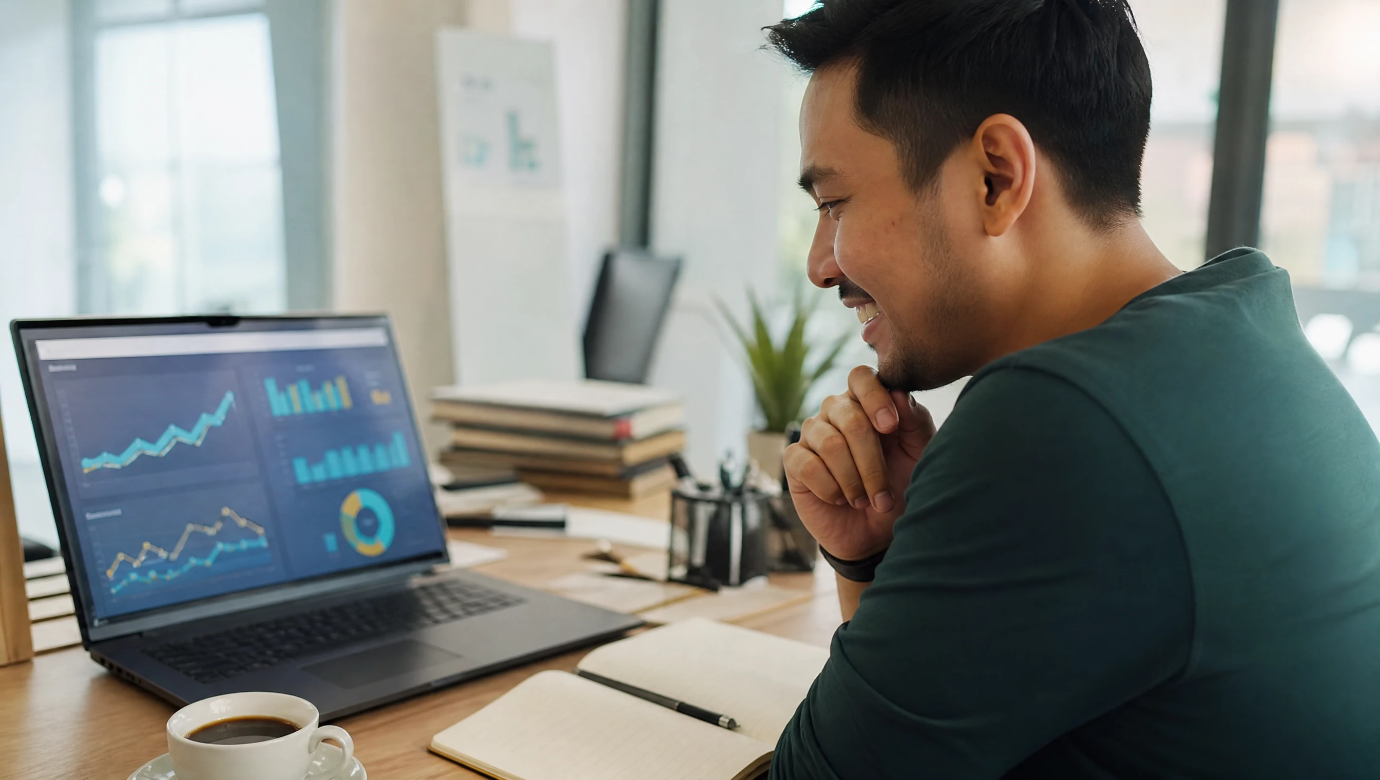 Malaysian digital marketer reviewing rising search analytics on a laptop